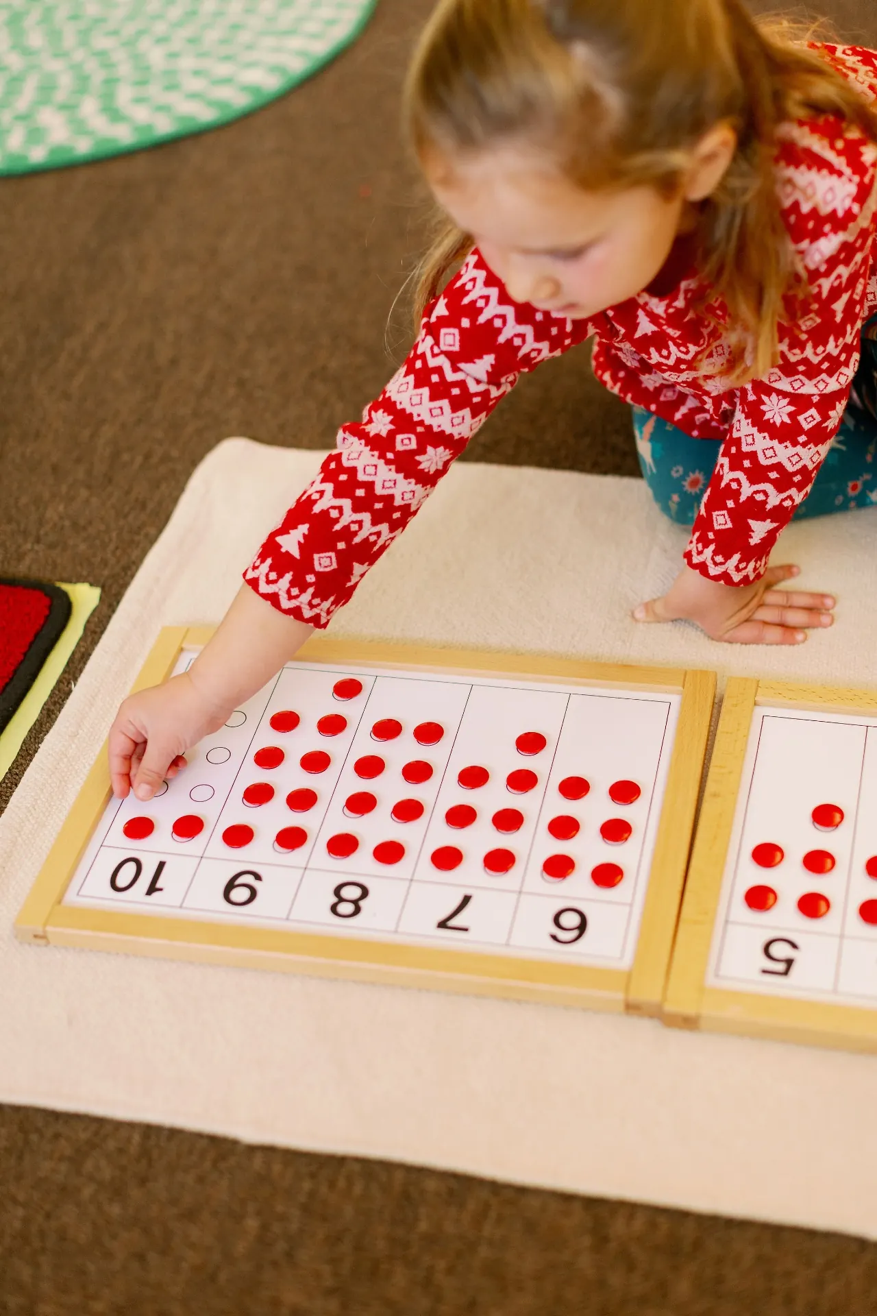 Child working with Montessori materials